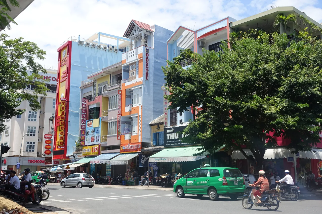 An everyday street in Da Nang with shops and local life