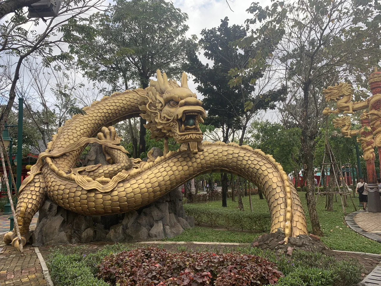 A golden dragon sculpture in an Asian-themed zone at Da Nang Downtown (Sun World Asia Park) A golden dragon sculpture in an Asian-themed zone at Da Nang Downtown (Sun World Asia Park)