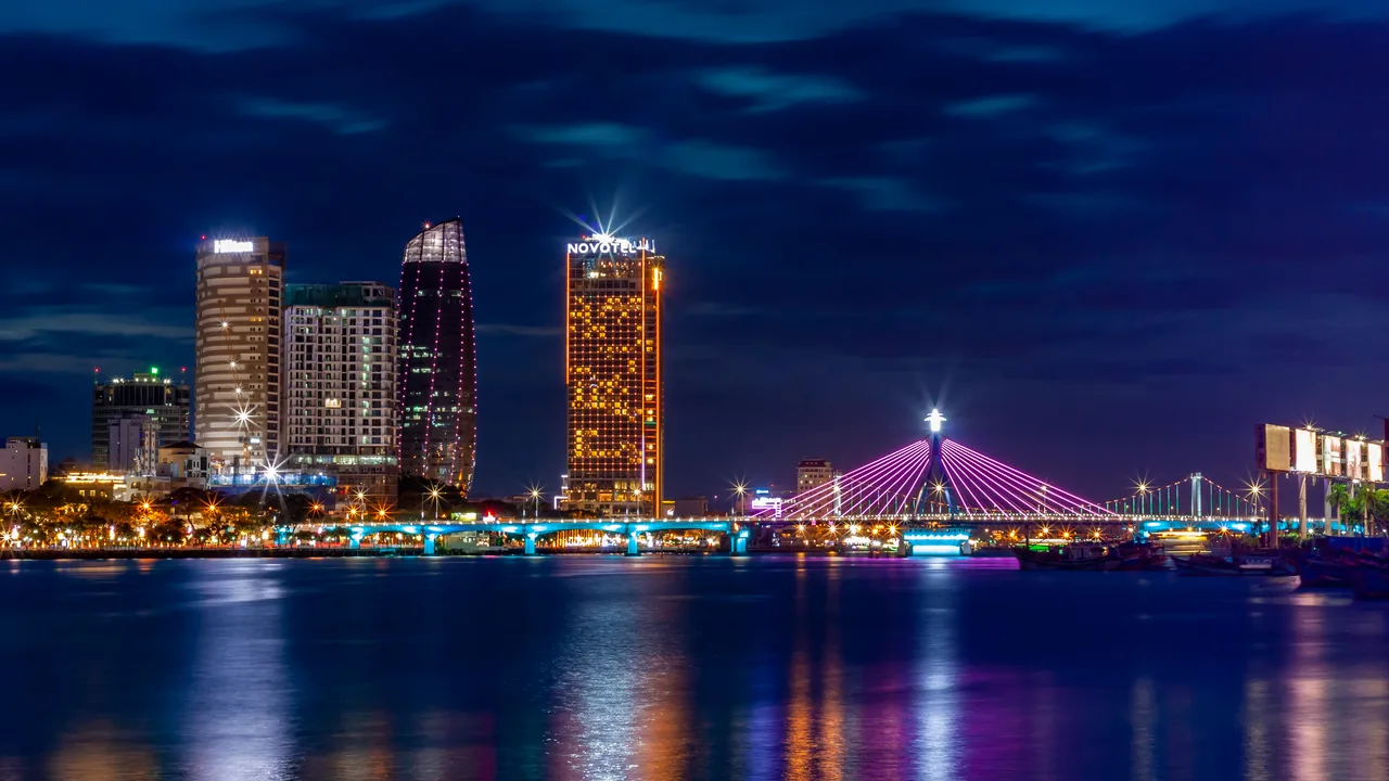 The Han River Bridge in Da Nang glowing at night