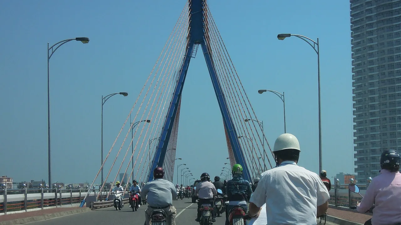 Motorbikes crossing the Han River Bridge in Da Nang traffic