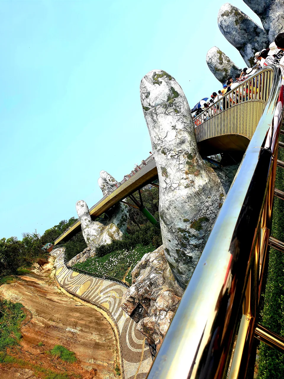 Close-up of one of the two giant weathered-stone hands that hold up the Golden Bridge
