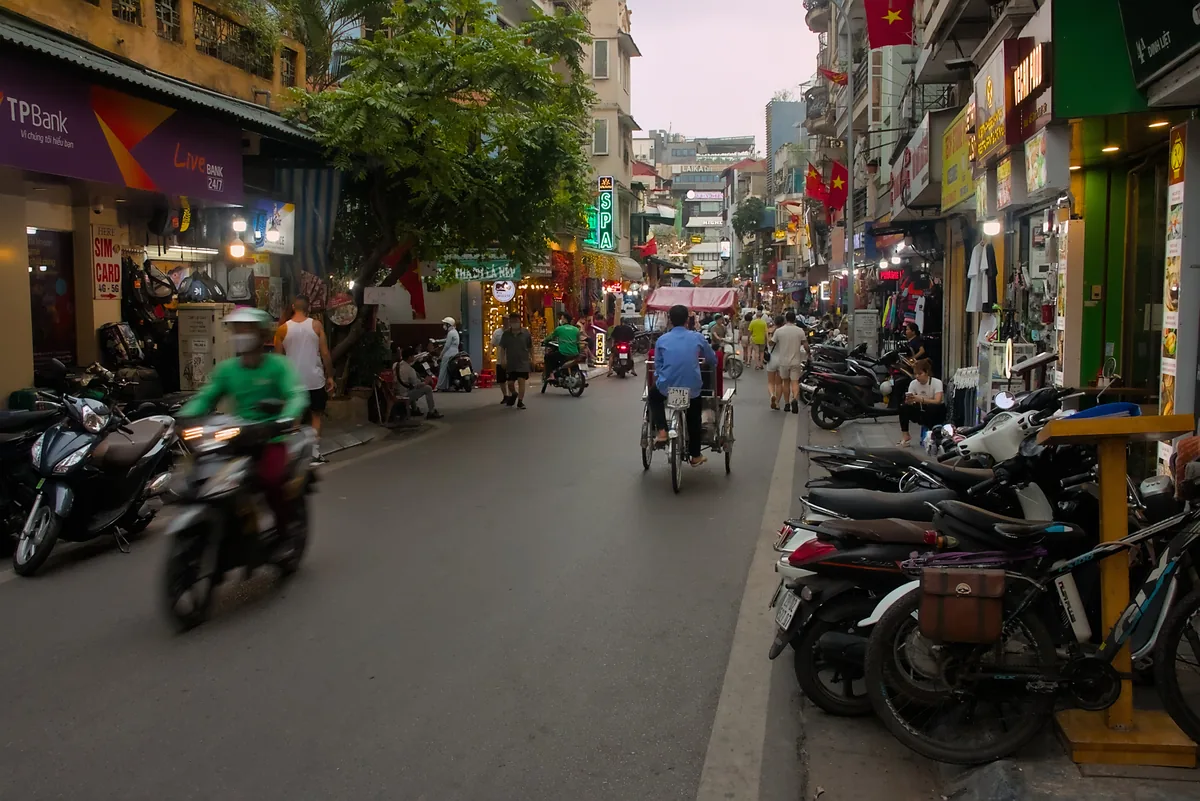 A Grab ride-hailing rider on a Vietnamese street