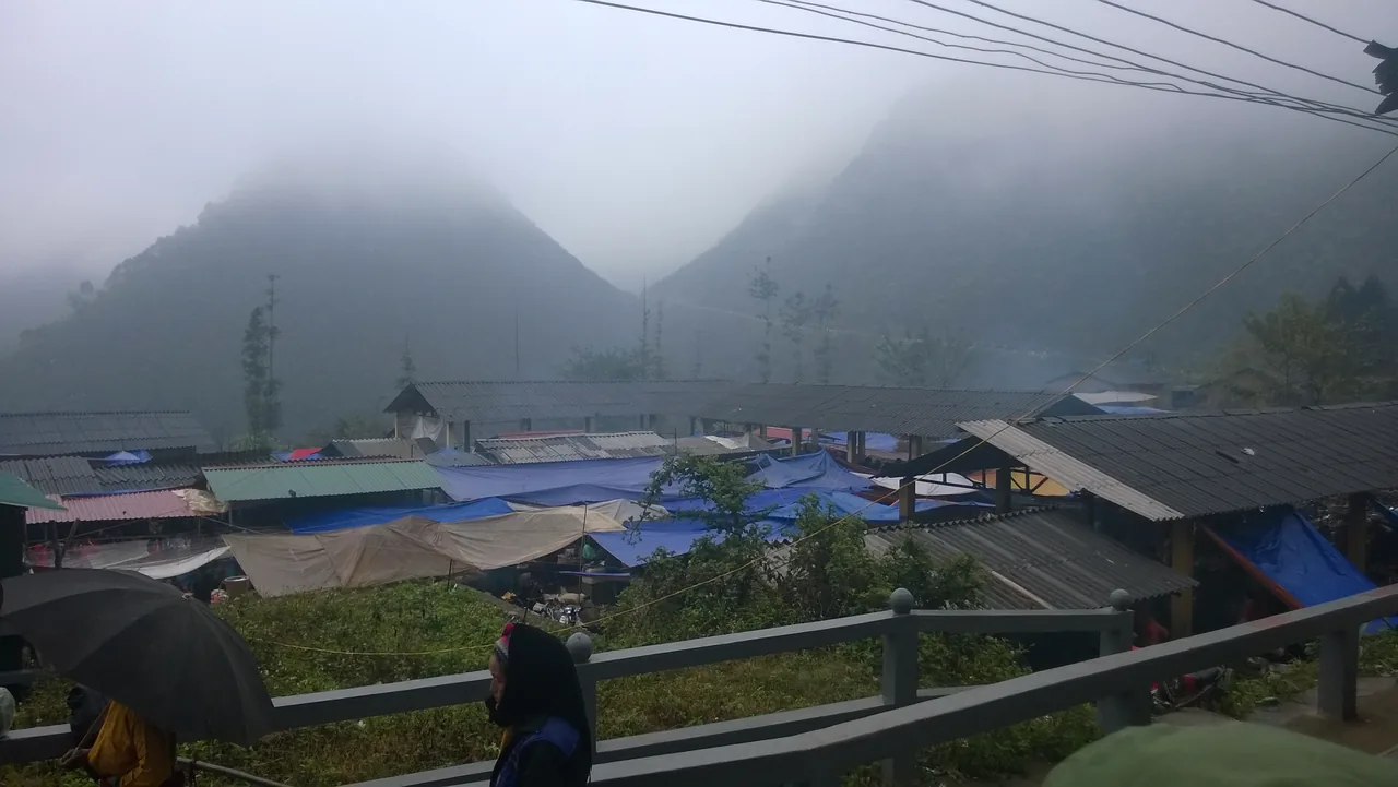 An ethnic-minority Hmong woman in traditional dress at a colourful highland market in Ha Giang An ethnic-minority Hmong woman in traditional dress at a colourful highland market in Ha Giang