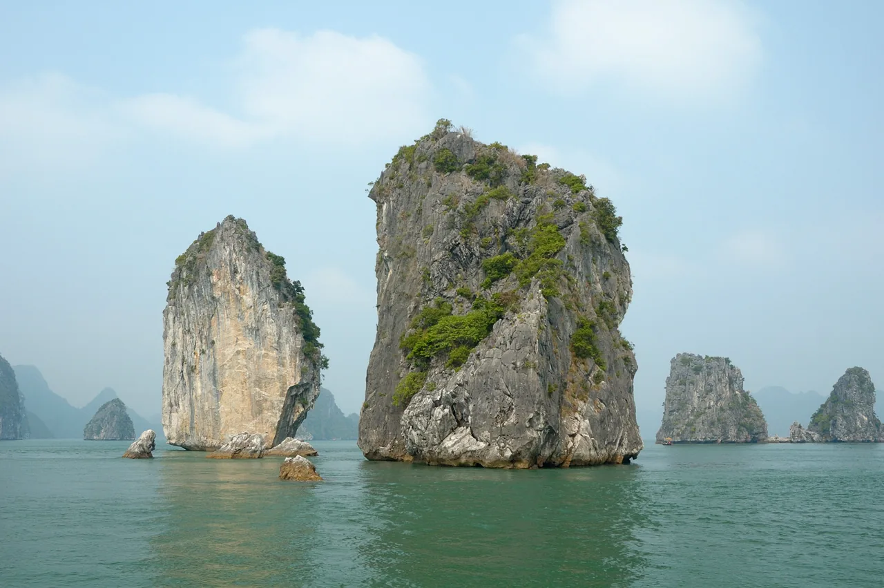 Limestone karst islands rising from the emerald water of Ha Long Bay, Northern Vietnam