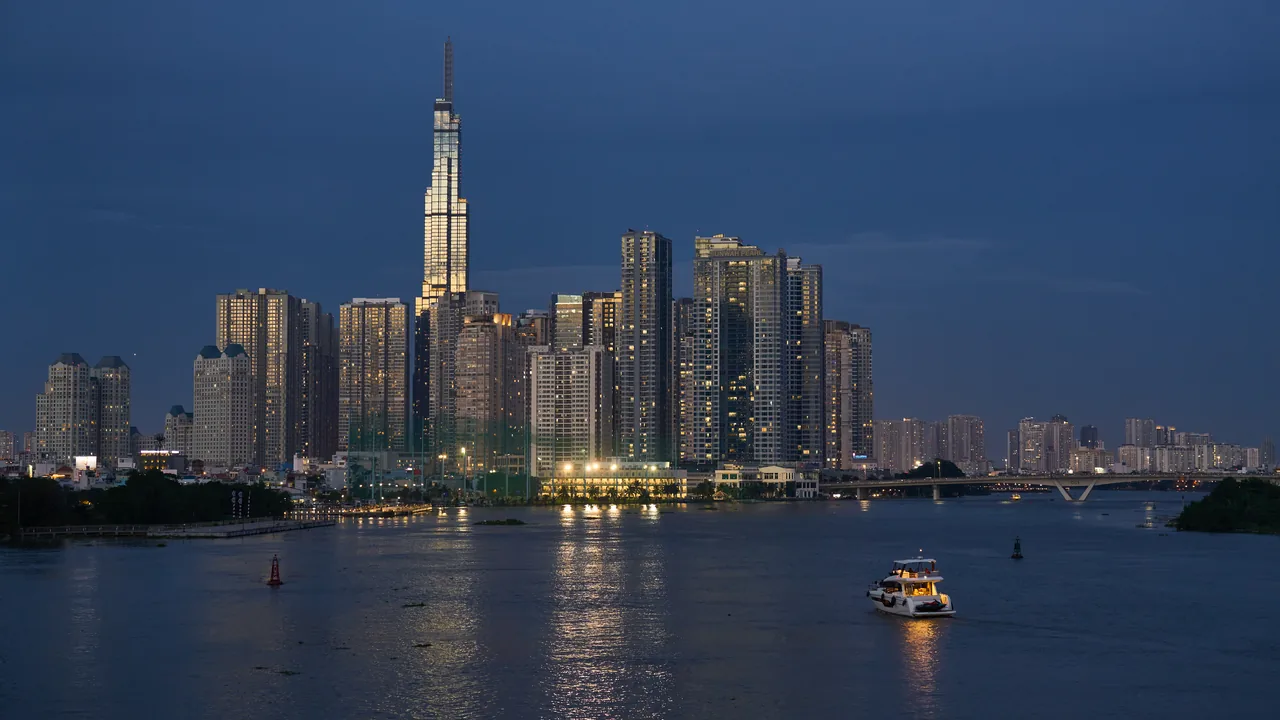 Ho Chi Minh City skyline at dusk with Landmark 81 over the Saigon River