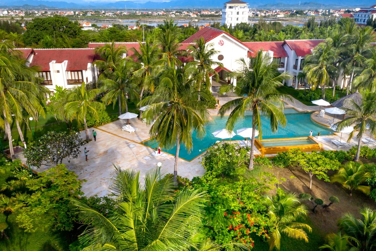 A tropical resort swimming pool seen from above