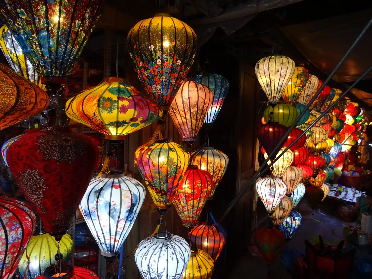 Glowing colourful silk lanterns hanging in a Hoi An lantern shop for the Mid-Autumn Festival