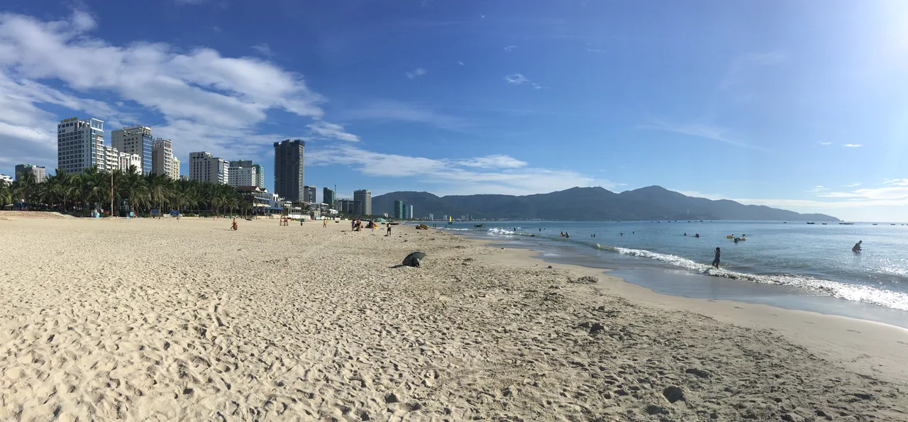 Da Nang's long My Khe Beach under wide summer skies