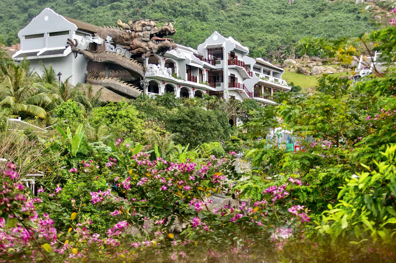 The hillside resort buildings and giant dragon sculpture at Nui Than Tai Hot Springs Park, Da Nang