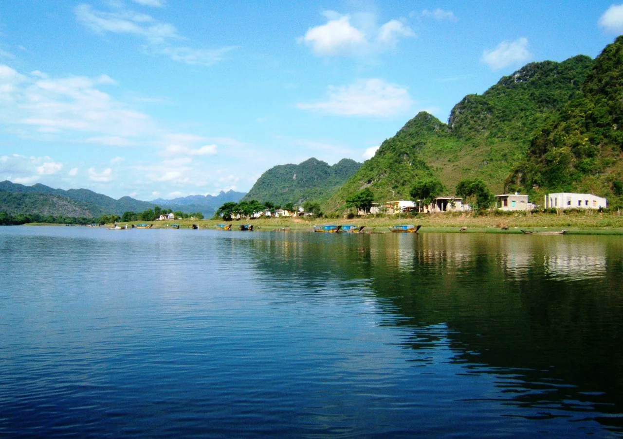 The Son River winding past karst mountains near Phong Nha village