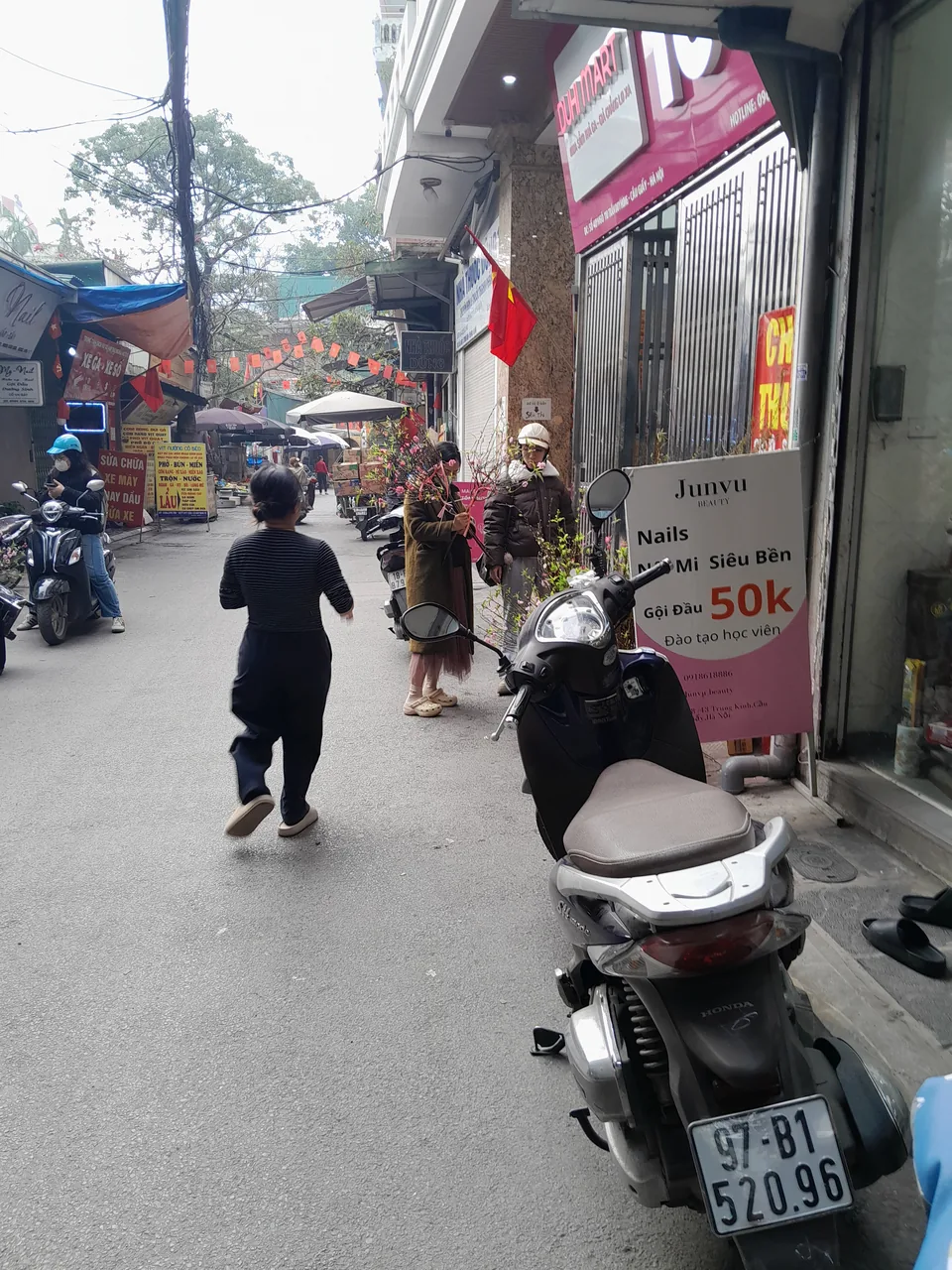 A Vietnamese market stocked with flowers and trees for the Tet Lunar New Year A Vietnamese market stocked with flowers and trees for the Tet Lunar New Year