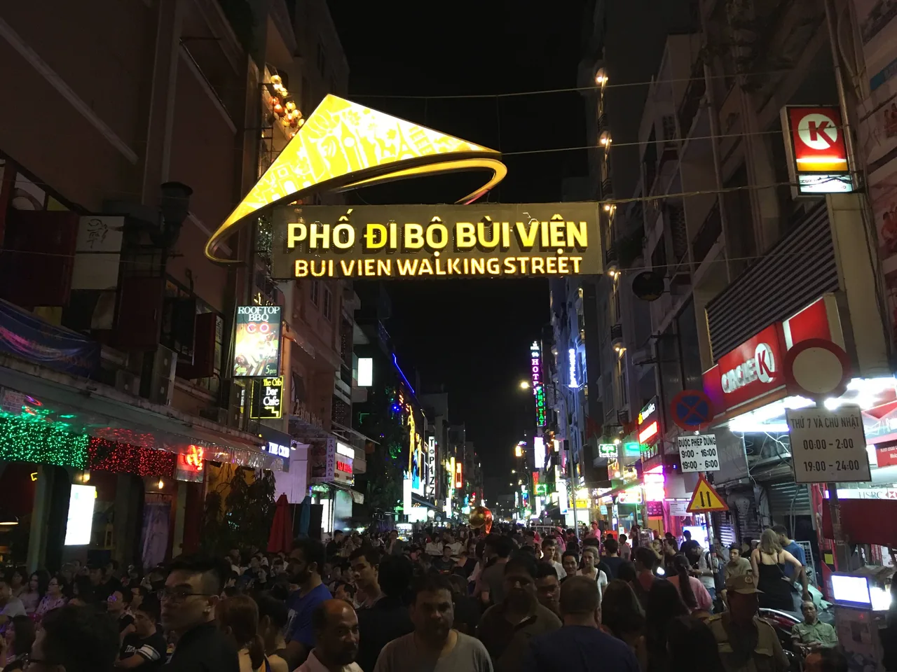 Bui Vien Walking Street, a neon-lit night street full of people in Ho Chi Minh City, Vietnam Bui Vien Walking Street, a neon-lit night street full of people in Ho Chi Minh City, Vietnam