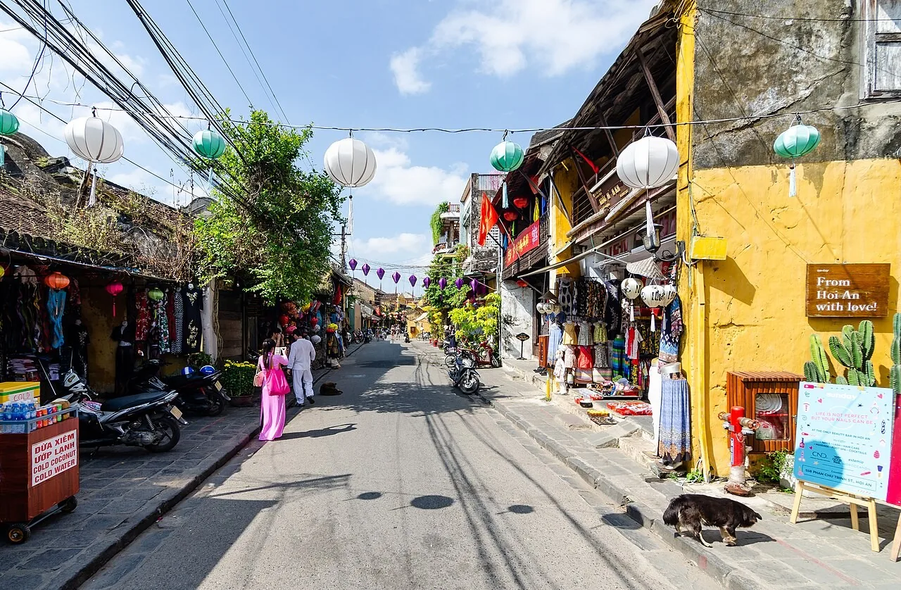 Ochre shophouses and hanging silk lanterns along Tran Phu Street in Hoi An during the day Ochre shophouses and hanging silk lanterns along Tran Phu Street in Hoi An during the day