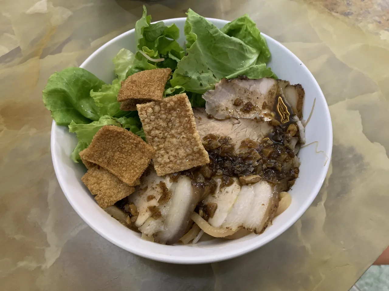 A bowl of cao lầu, Hoi An's signature noodle dish with char siu pork