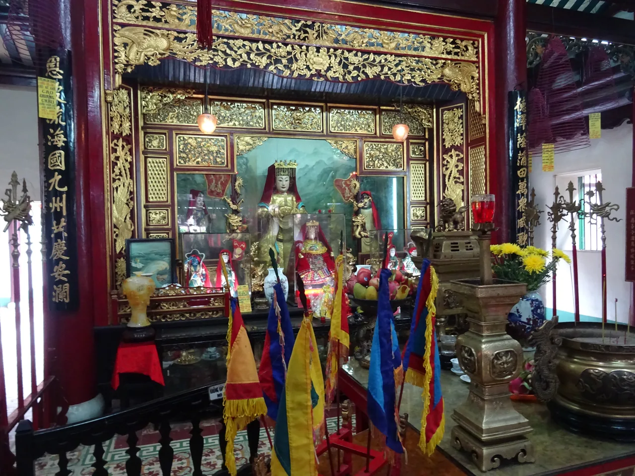 The ornate carved interior of the Fujian Assembly Hall in Hoi An