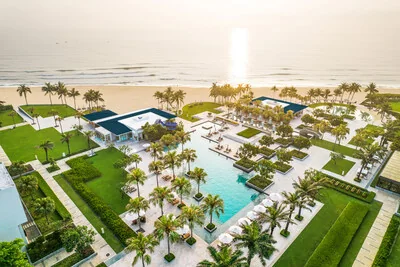 Sunset over the pool deck and private beach at Hyatt Regency Danang Resort and Spa on Non Nuoc Beach