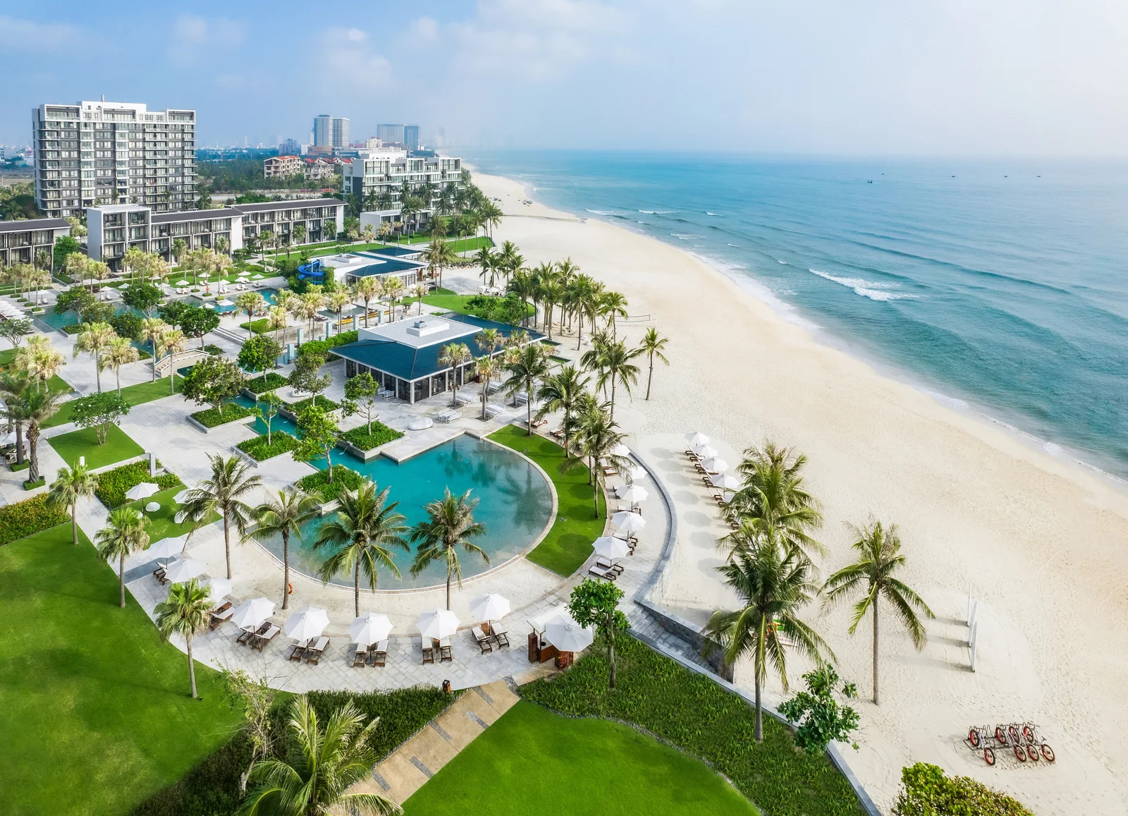Aerial view of Hyatt Regency Danang Resort and Spa's low-rise buildings, gardens and pool along Non Nuoc Beach