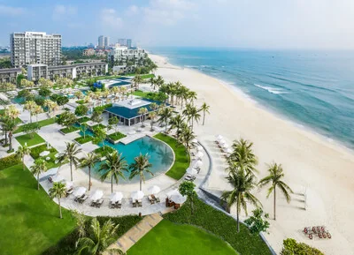 Aerial view of Hyatt Regency Danang Resort and Spa's beachfront gardens and buildings along Non Nuoc Beach