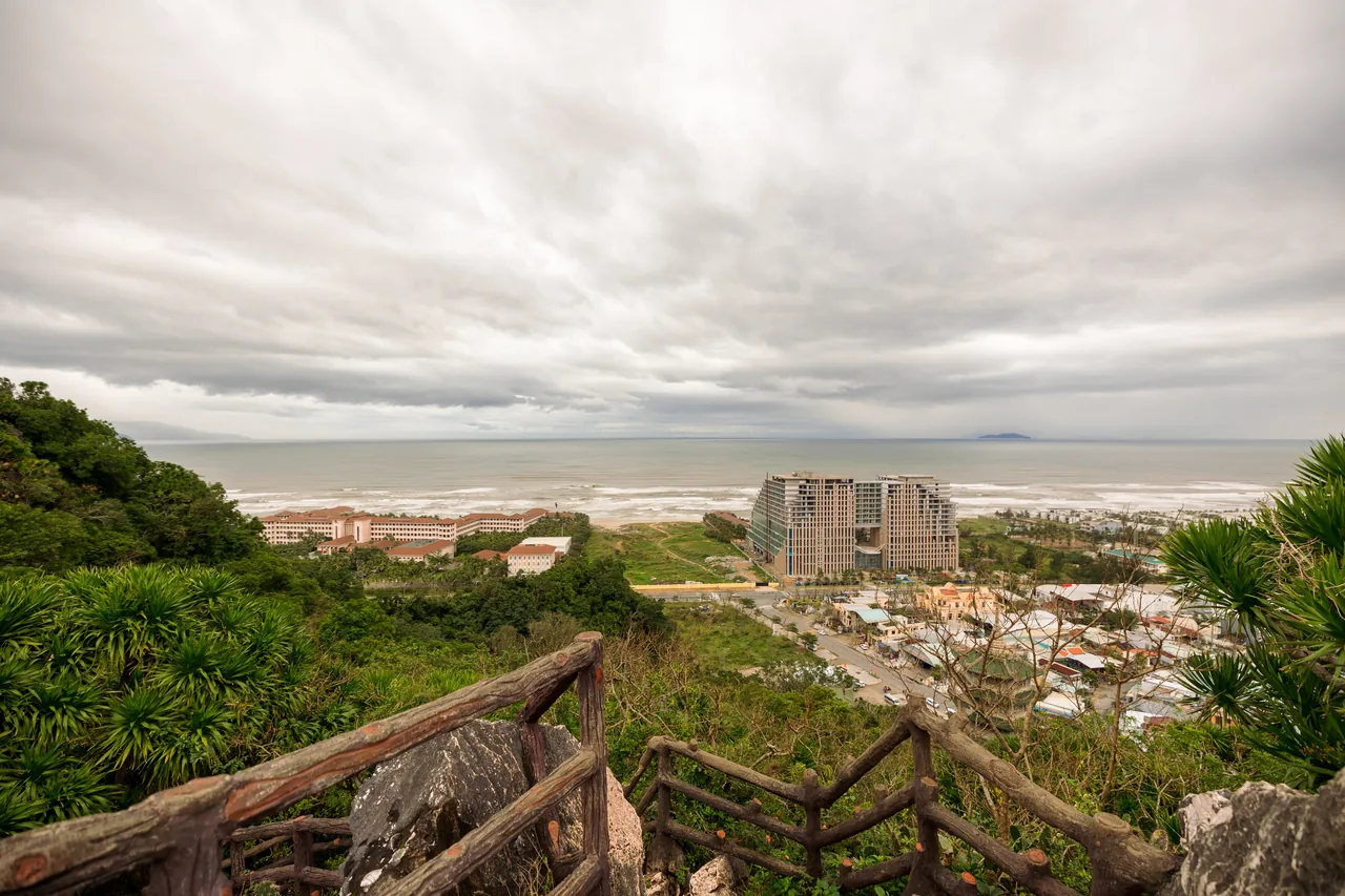 A stone staircase viewpoint over the Da Nang coastline from the Marble Mountains