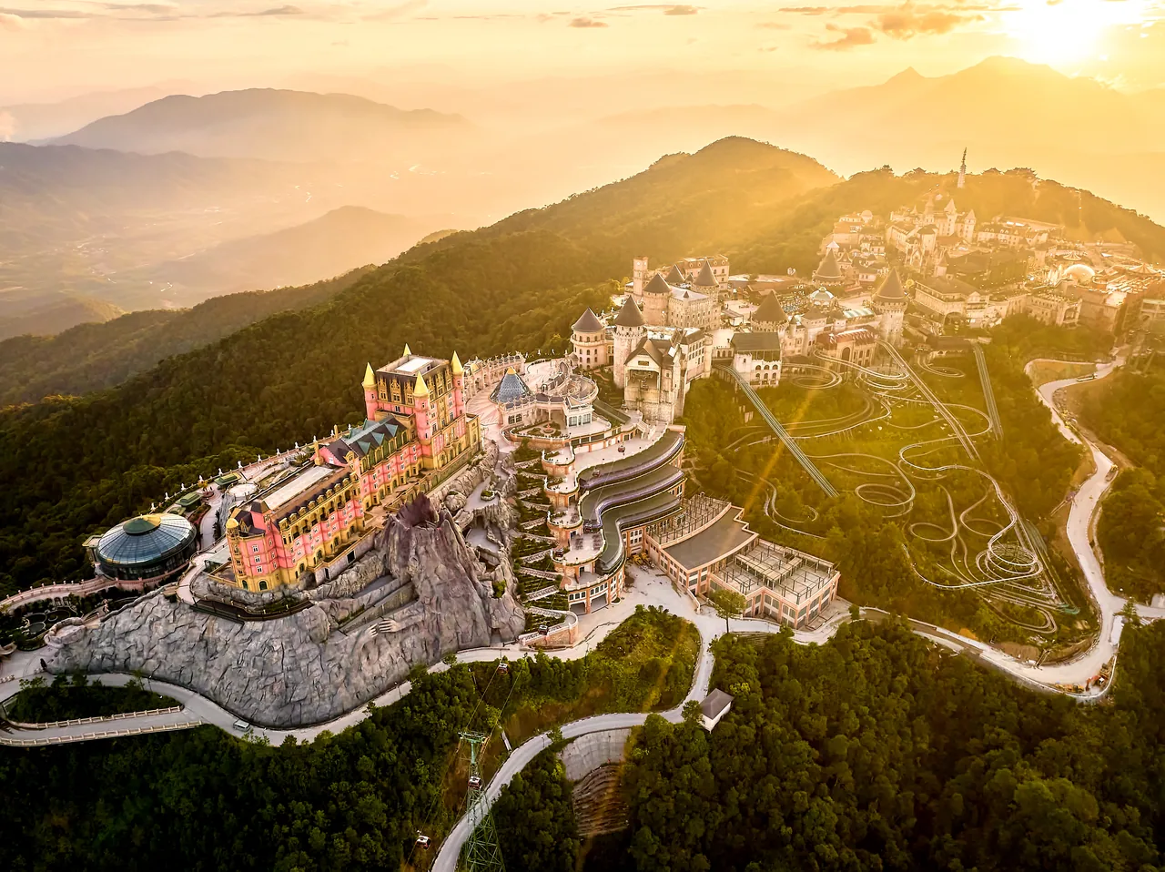 Aerial overview of the Sun World Ba Na Hills summit complex at sunset