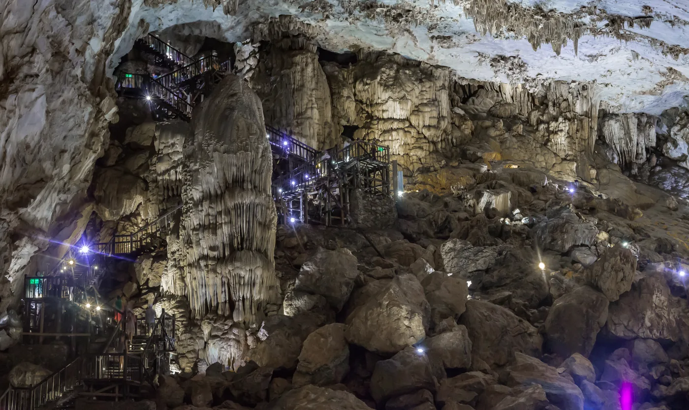 The vast lit chamber of Paradise Cave (Thien Duong) in Phong Nha, a boardwalk winding between huge stalactites.