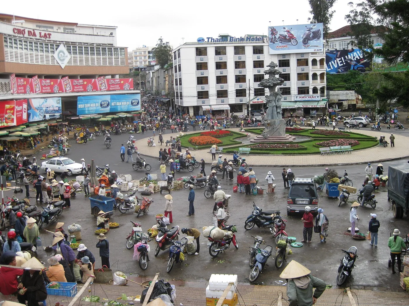 The roundabout in front of Da Lat market in the morning, full of scooters