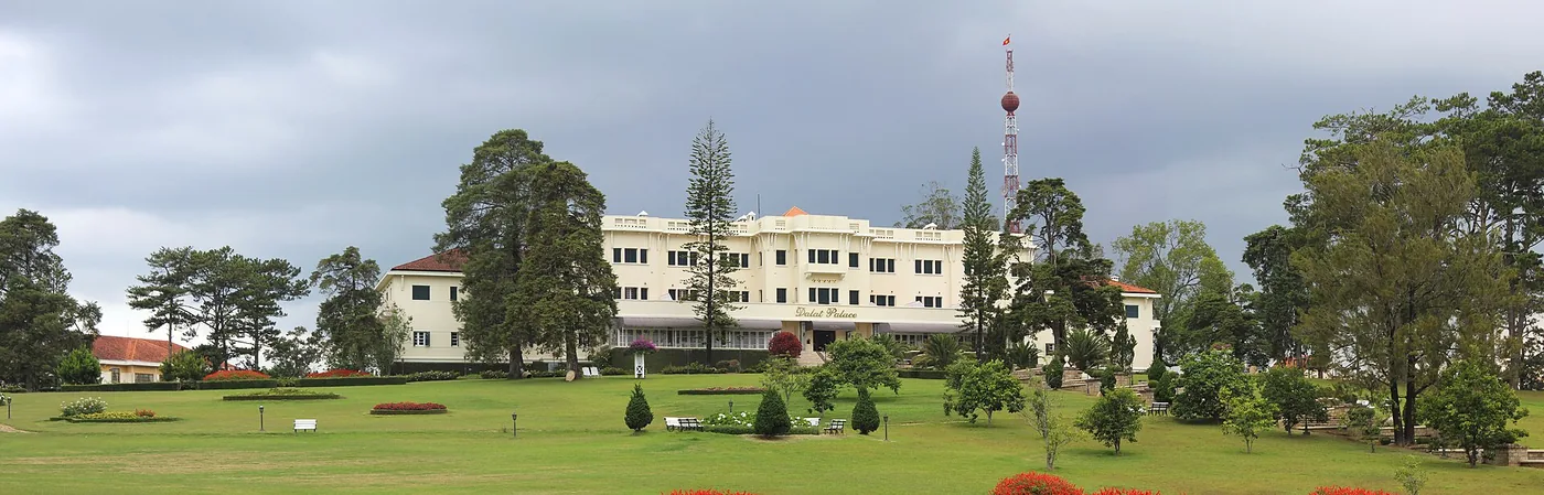 The Dalat Palace hotel and its lawn seen from the lake side