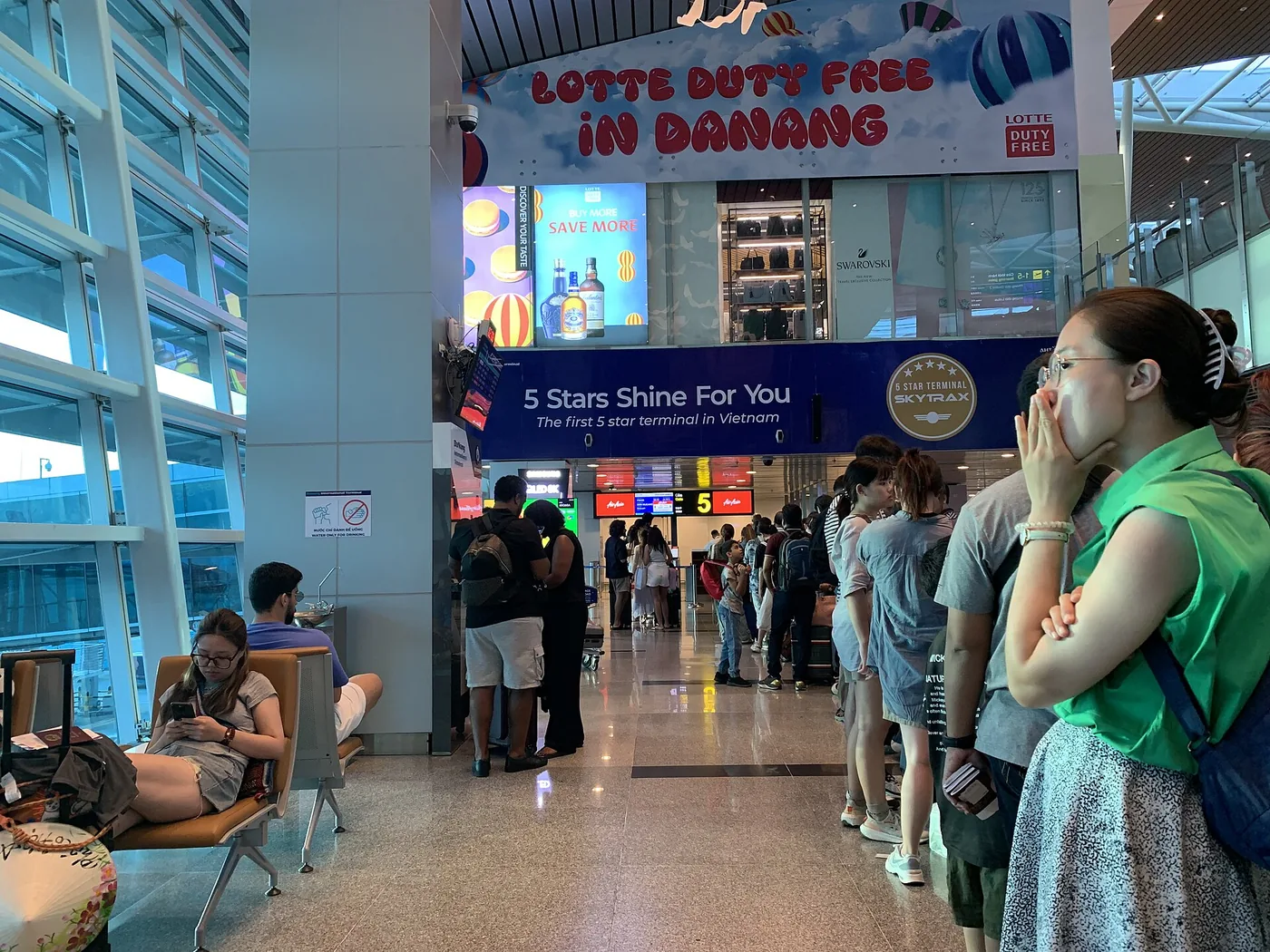Passengers standing in a line inside the international terminal at Da Nang airport