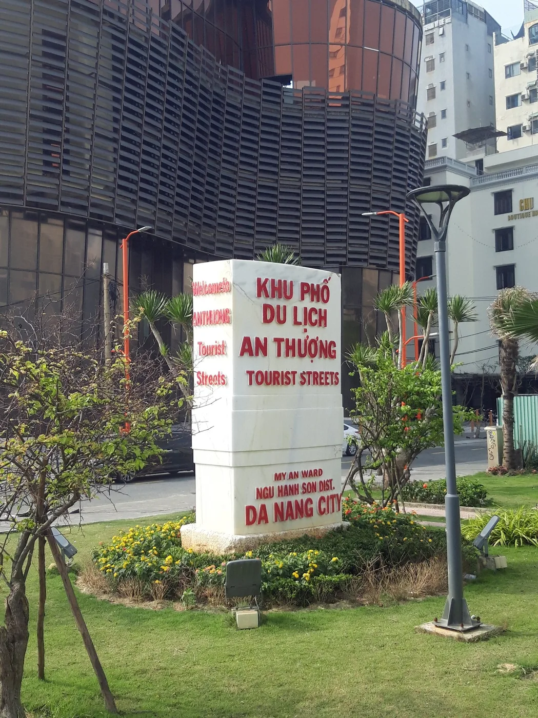 The white stone marker at the entrance to the An Thuong tourist streets in Da Nang, lettered in red in Vietnamese and English