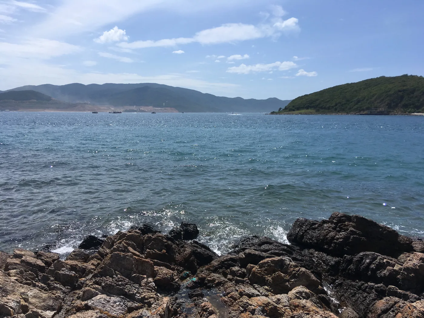 Clear water and rocky island shores in Nha Trang Bay