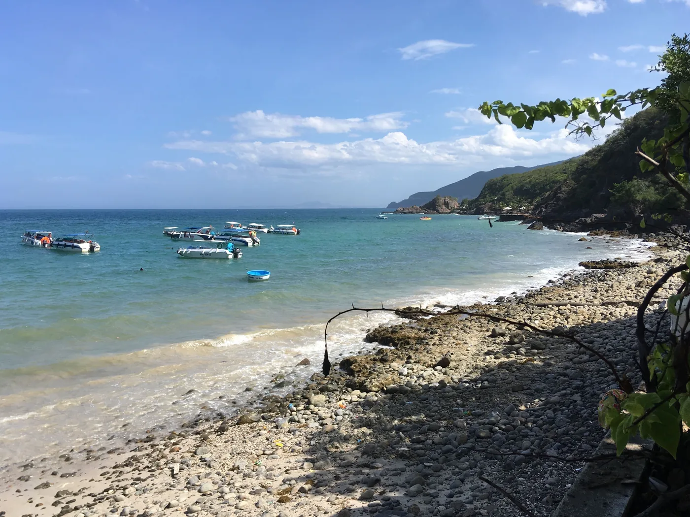 Speedboats moored off Bai Tranh beach on a Nha Trang island hopping tour