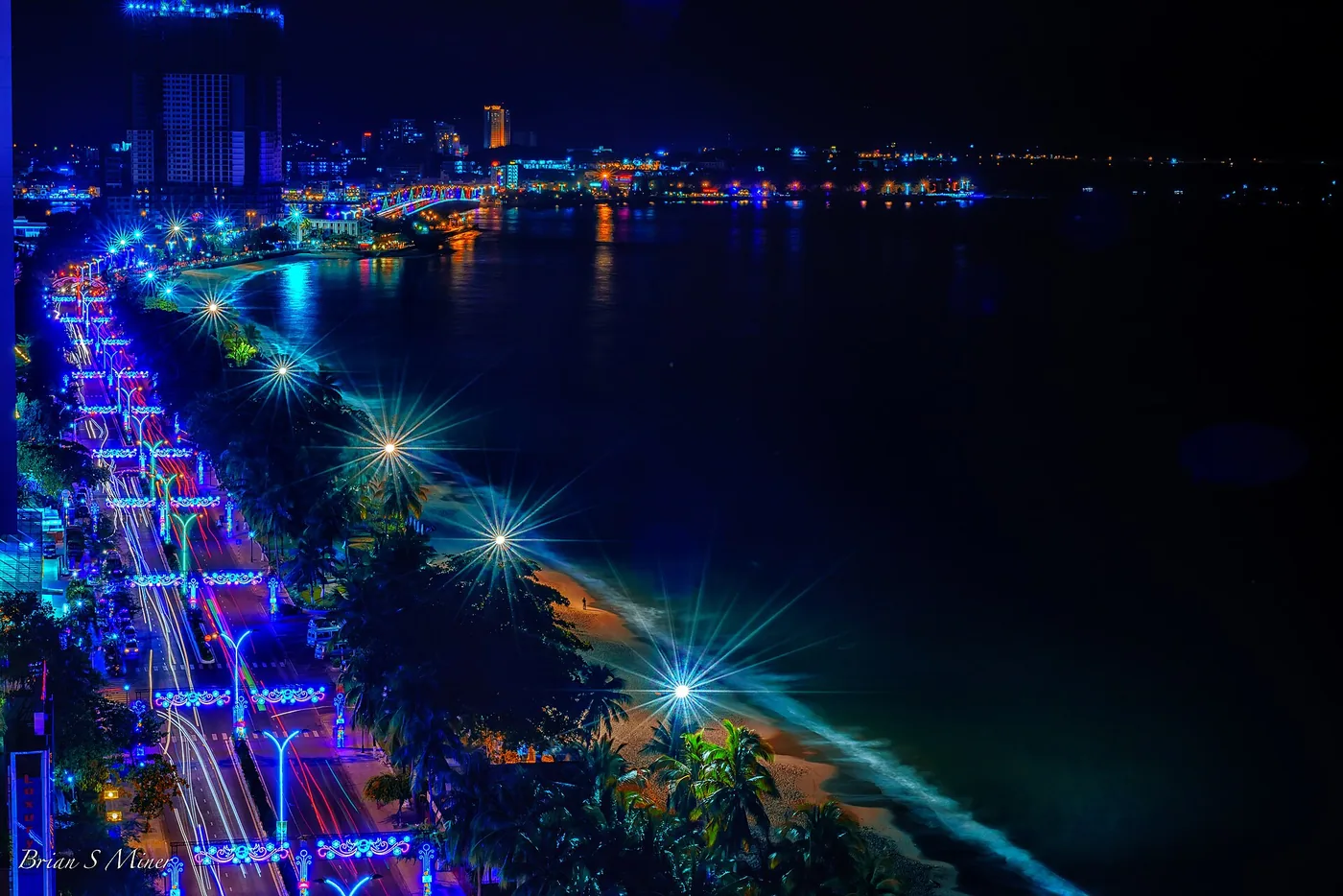 Nha Trang beachfront and city towers lit up at night