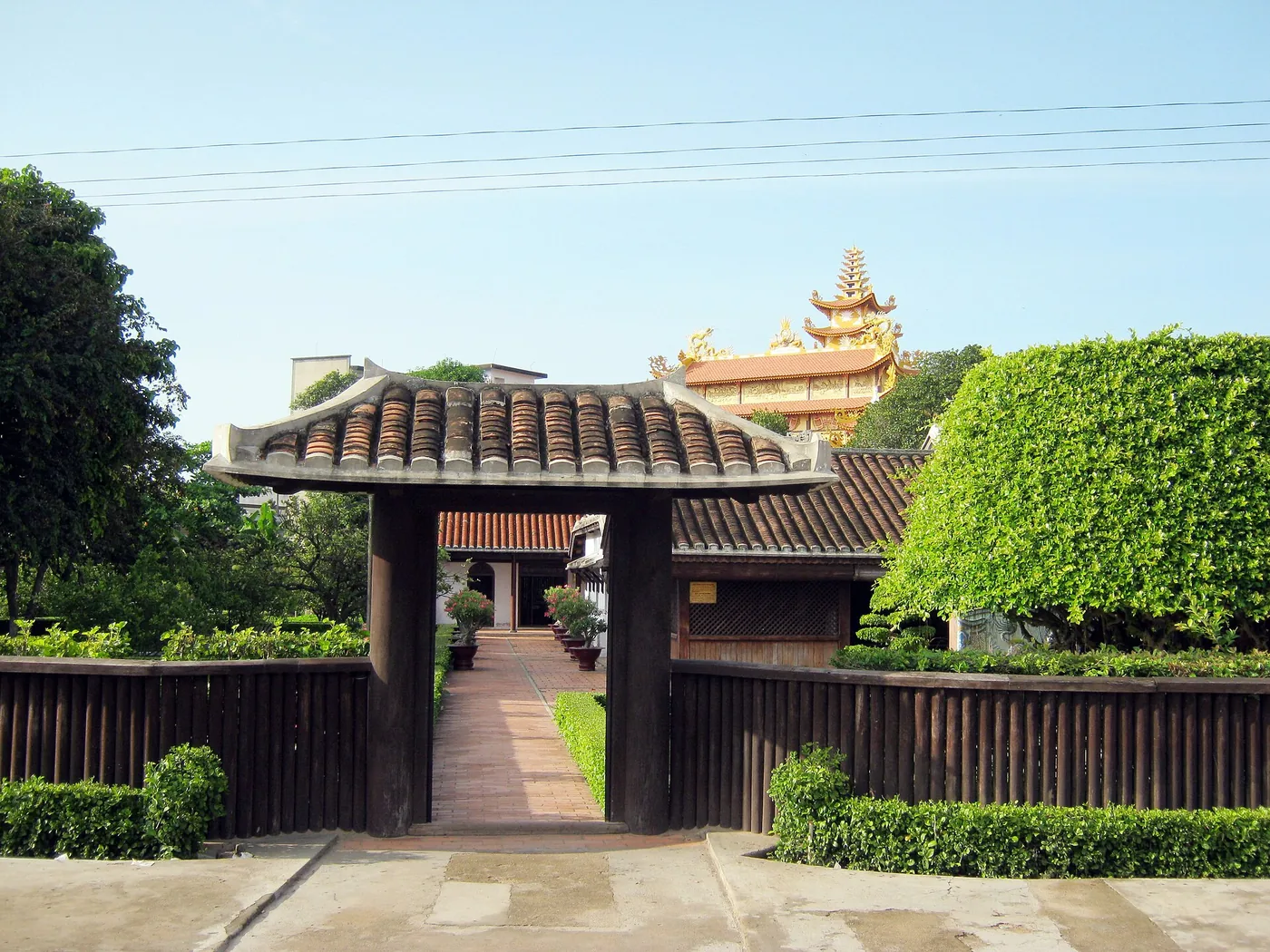 The tiled gate and hedge at the entrance of Duc Thanh school in Phan Thiet The tiled gate and hedge at the entrance of Duc Thanh school in Phan Thiet
